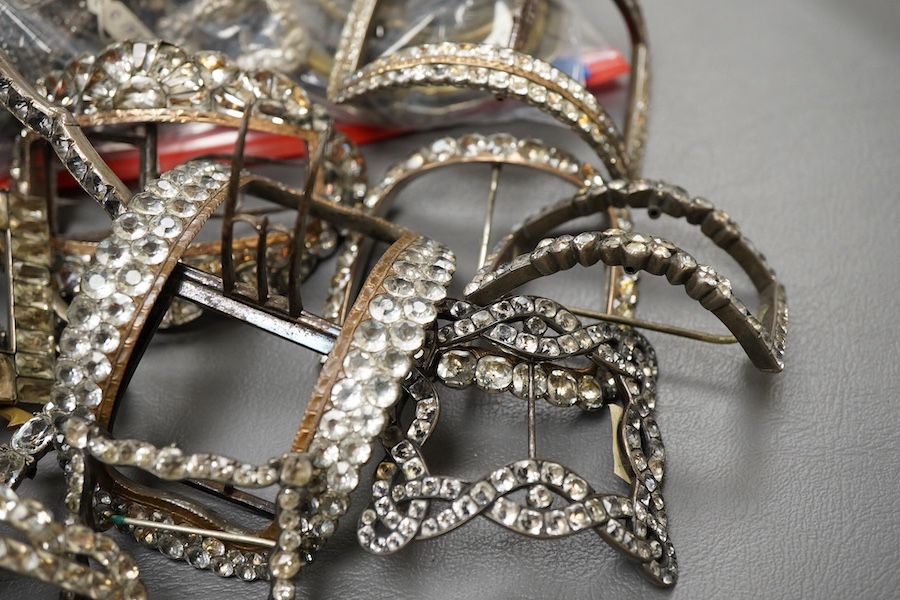 A large collection of buckles, 18th-19th century, of oval and rectangular outline, set with pastes or cut steel, mostly mounted in steel, a minority in silver, some with later brooch fittings